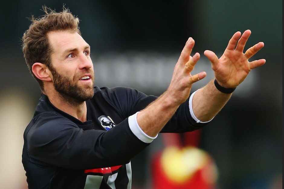 AFL 2016 Training - Collingwood 140716 MELBOURNE, AUSTRALIA - JULY 14: Travis Cloke of the Magpies, who found himself in trouble with AFL for wearing non-approved gloves during the game on the weekend, marks the ball during a Collingwood Magpies training session at Gosch's Paddock on July 14, 2016 in Melbourne, Australia. (Photo by Michael Dodge/Getty Images/AFL Media)